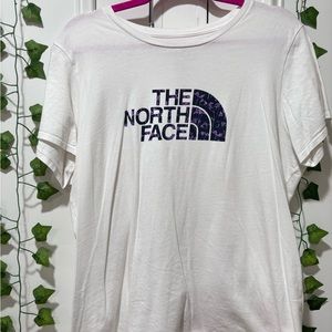 White and purple north face tee